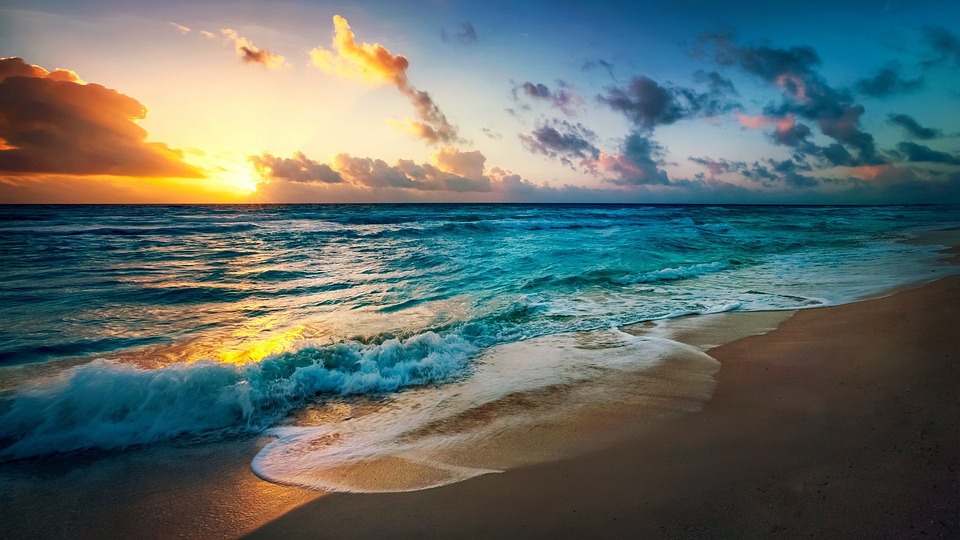 Unwind and Immerse Yourself in the Serene Beauty of a Tropical Beach Sunset